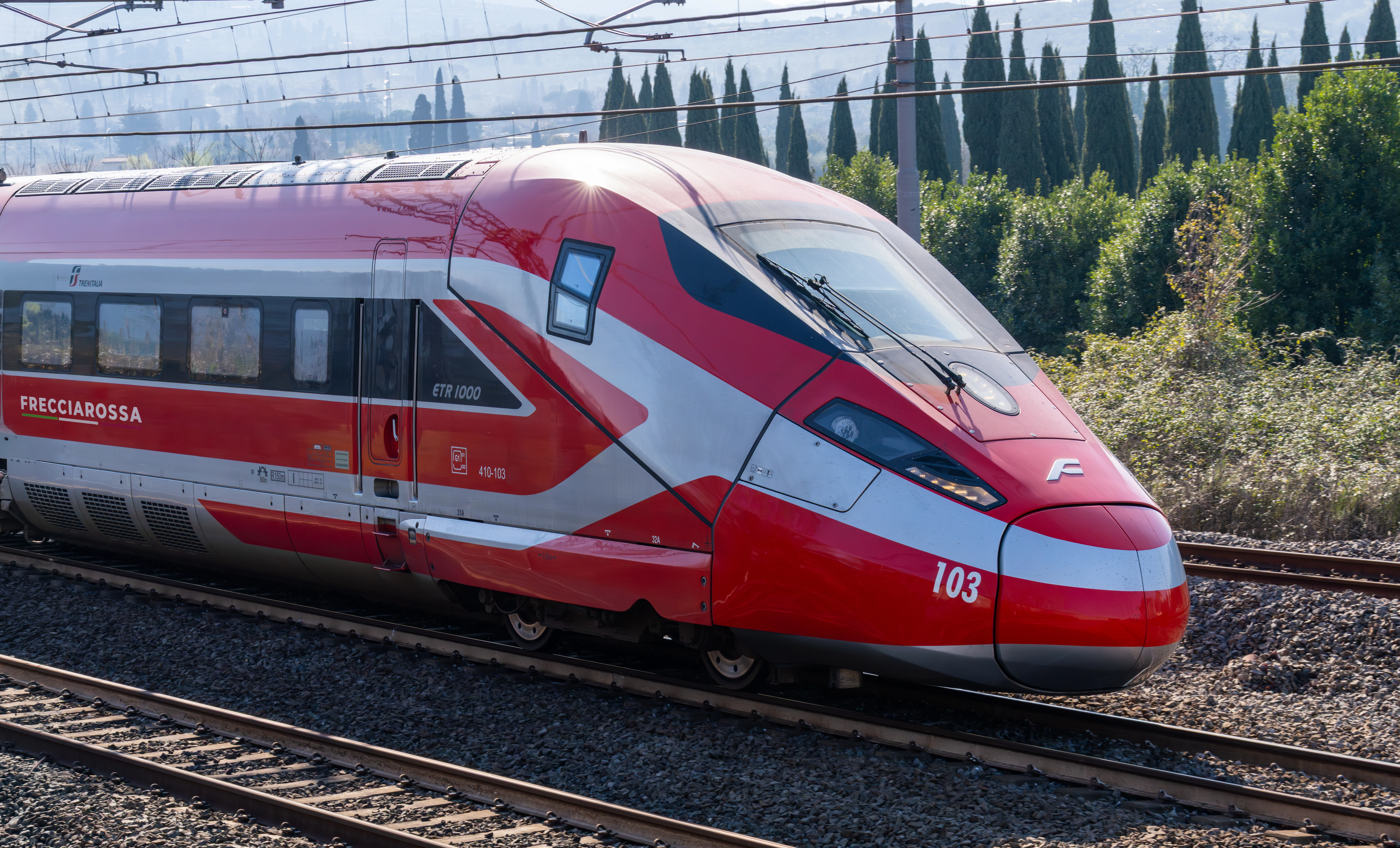 Trenitalia Frecciarossa high-speed train travelling on railway tracks in Italy