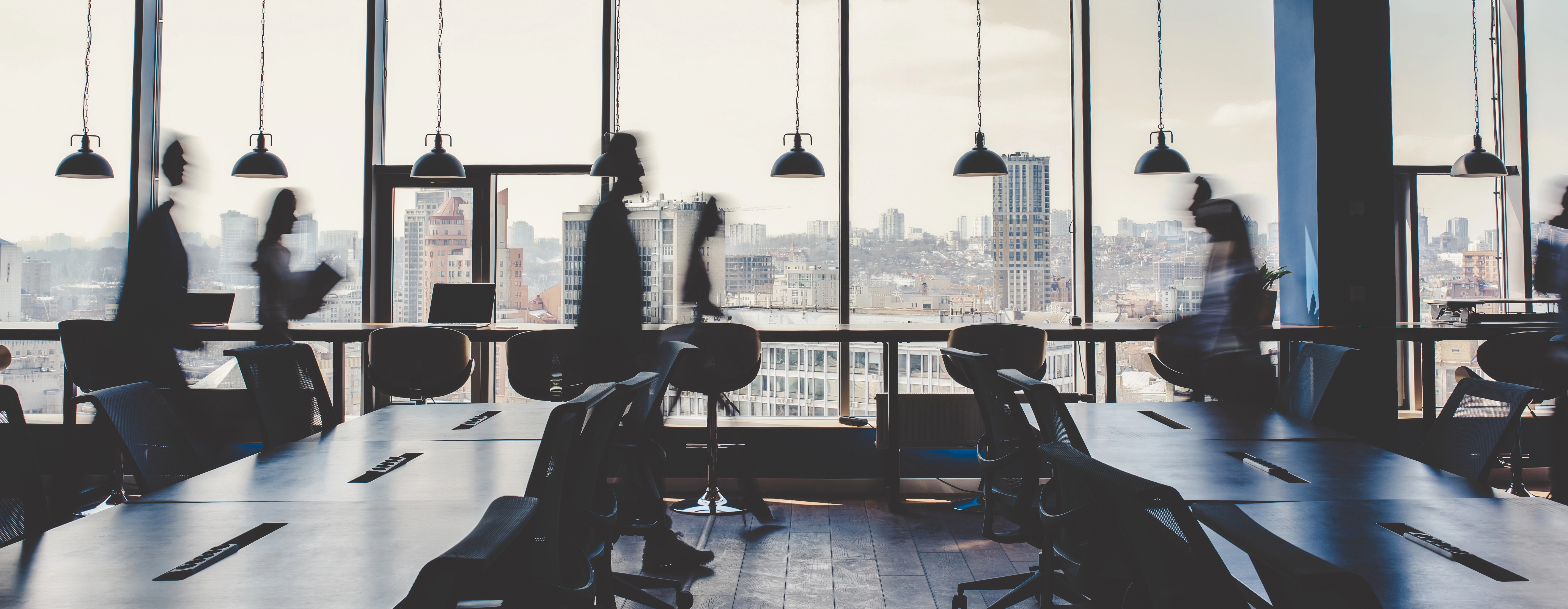 Modern office interior with business professionals and panoramic city views